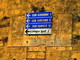 Sanremo: nuova segnaletica verticale applicata su un cartello vecchio di anni alla Madonna della Costa