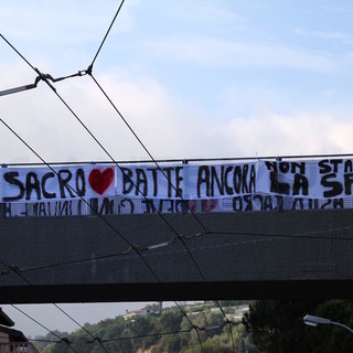 Uno striscione dei "bussanelli" per il loro asilo