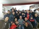 La squadra dell'Unione Camporosso Calcio con il campione di Handbike Saverio Di Bari (foto tratta dalla Pagina Facebook del club rossoblu)