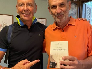 Gipo Anfosso con la polo arancione