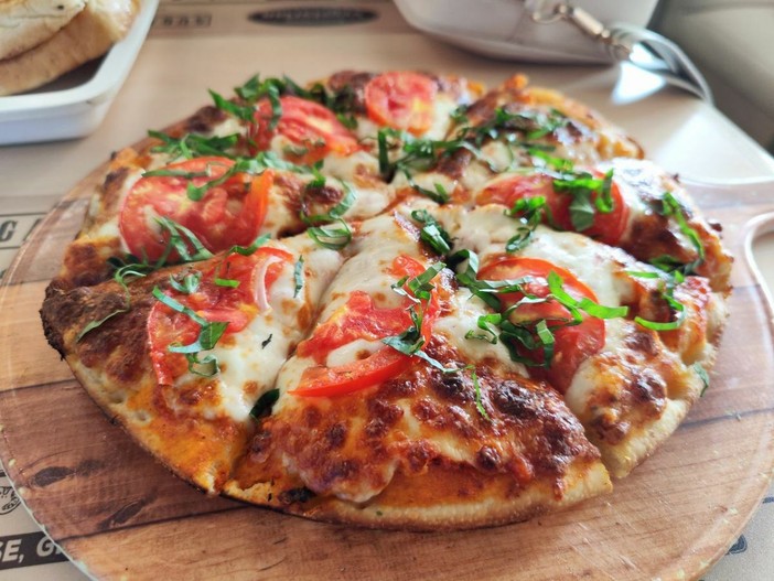 Ricetta per la pizza al trancio toscana al ristorante tipico Ricetta per la pizza al trancio toscana al ristorante tipico